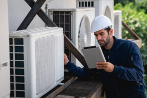 Engineers are inspecting the air conditioning cooling system of a large building or industrial facility.